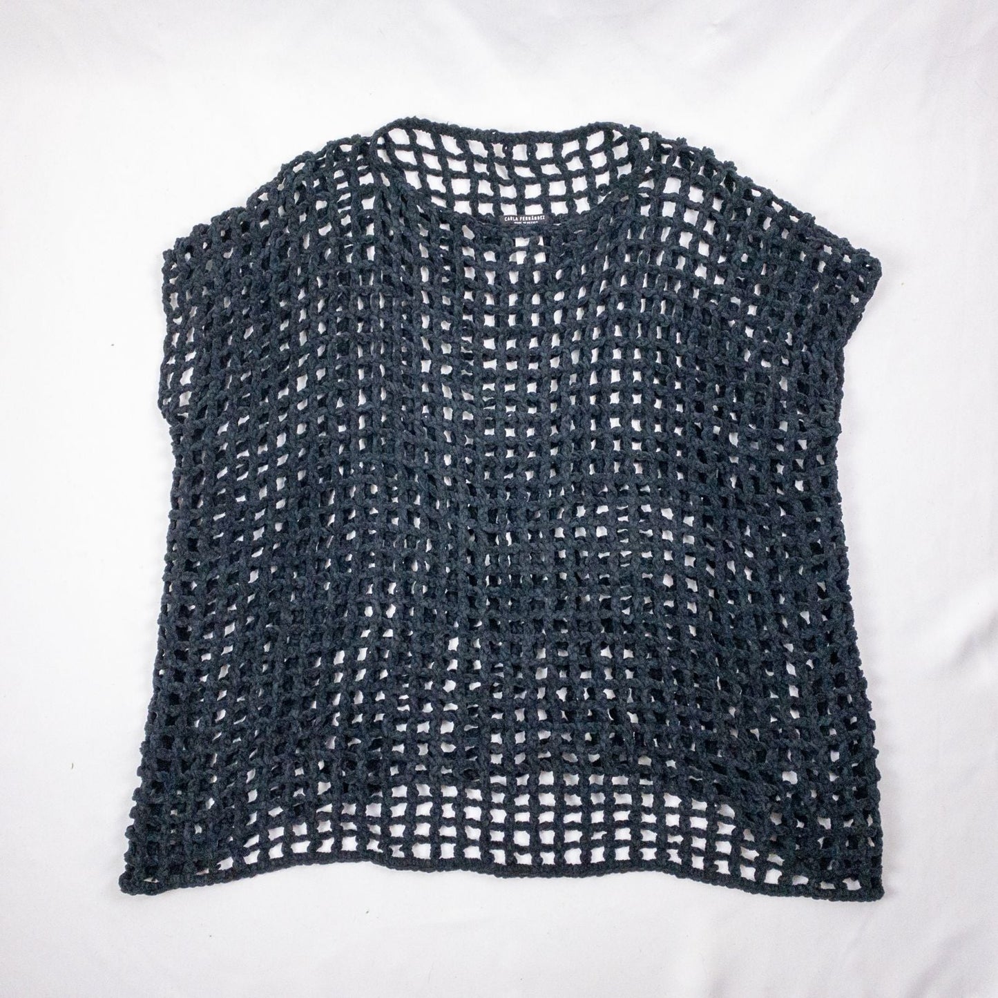 Carla Fernandez black fishnet knit rope sweater with short sleeves displayed on a hanger against a white background image 13