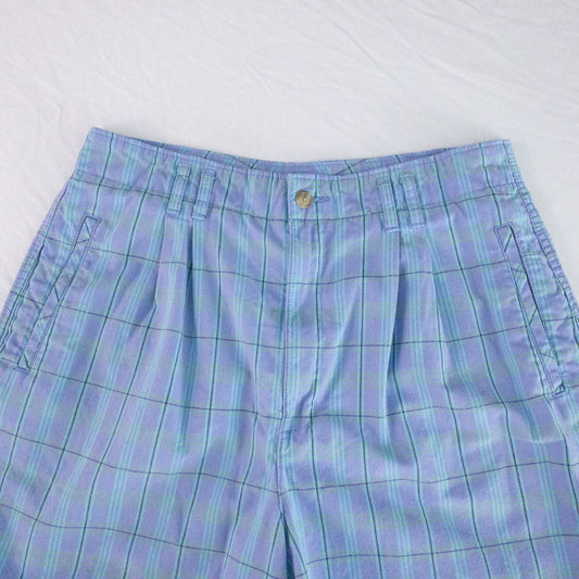 Levis Dockers purple plaid women's shorts laid flat showing front, side pockets, waistband details, and small wear dot image 2