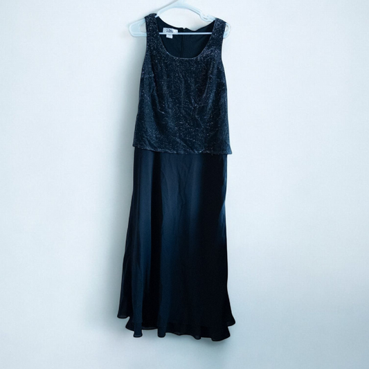 Patra vintage black metallic evening dress womens size 10 hanging on white hanger with metallic shimmer tank top and flowing black skirt.