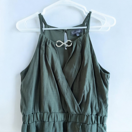 Luxology green slit maxi dress hanging on a hanger in front of a mirror image 2