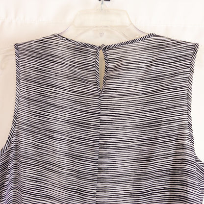 Elle black and white striped sleeveless tank top with peplum hem on clear hanger image 5