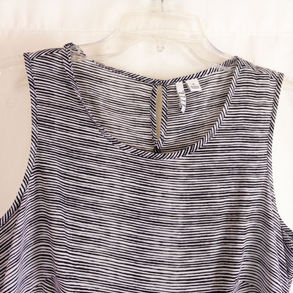 Elle black and white striped sleeveless tank top with peplum hem on clear hanger image 2