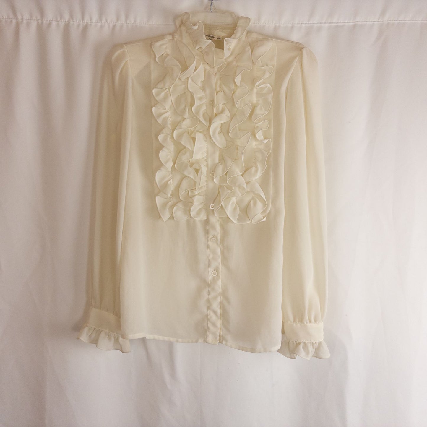 Vintage ivory ruffle blouse with long sleeves and button front