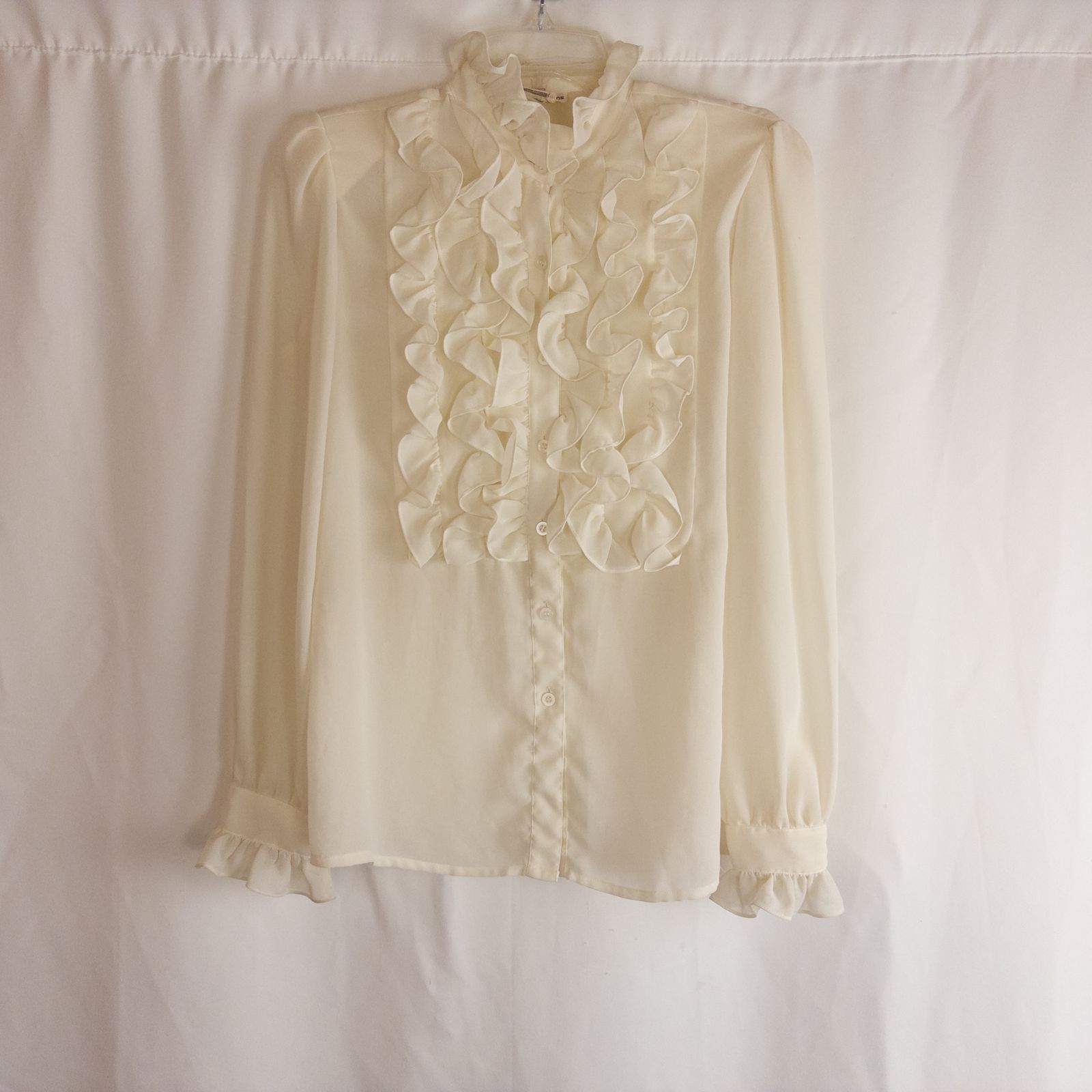 Vintage ivory ruffle blouse with long sleeves and button front