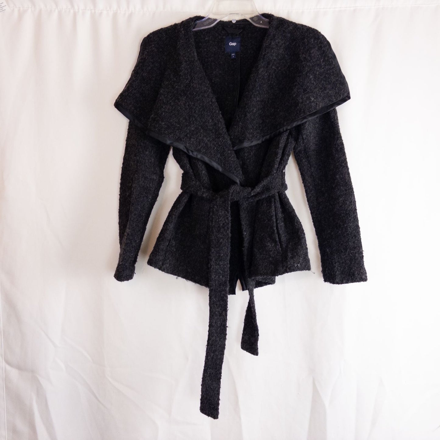 Gray Gap wool textured jacket with shawl collar and belt hung on white background