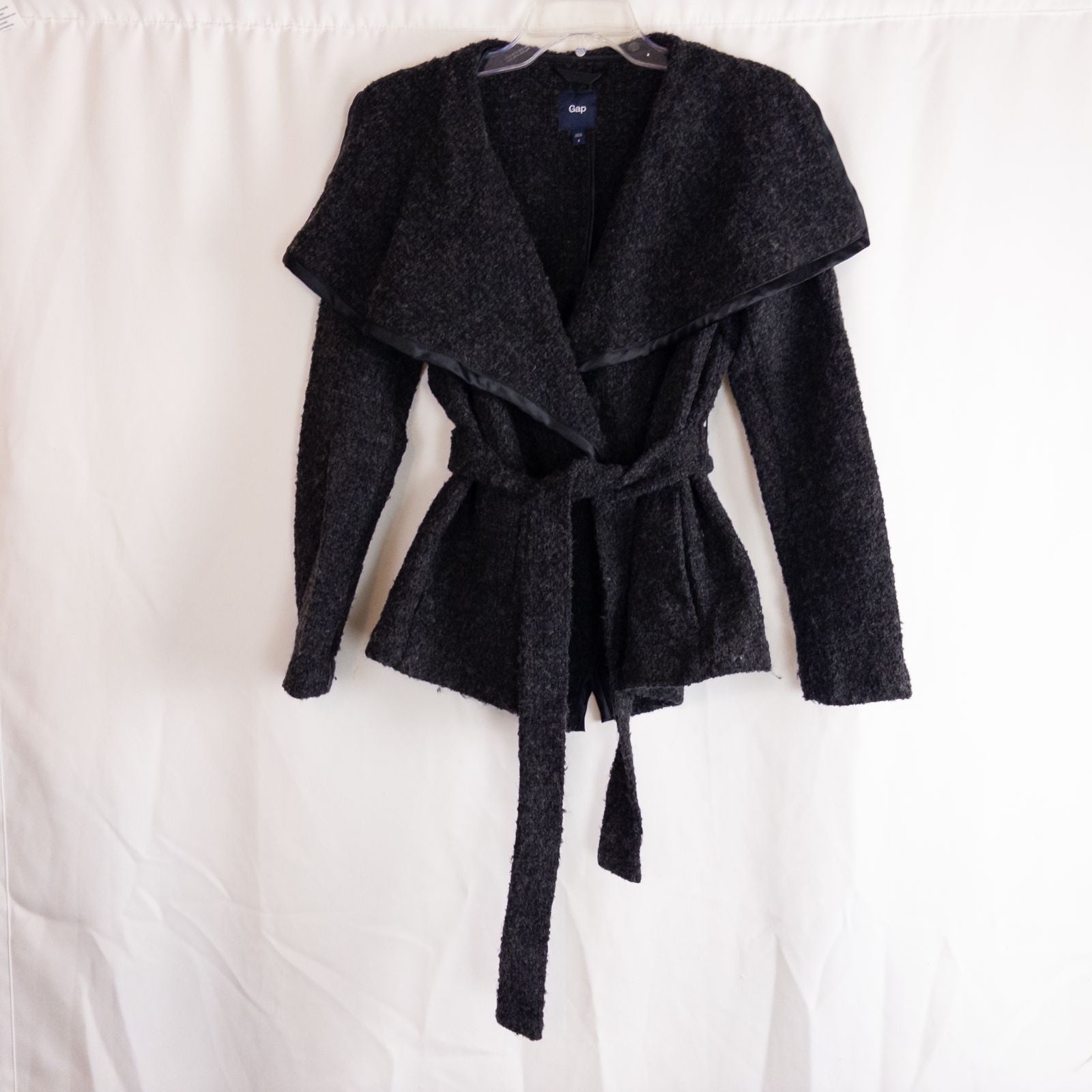 Gray Gap wool textured jacket with shawl collar and belt hung on white background