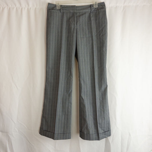Tracy Evans vintage black plaid check women's pants size 11 displayed front and back with side zipper closure and cuffed hems.
