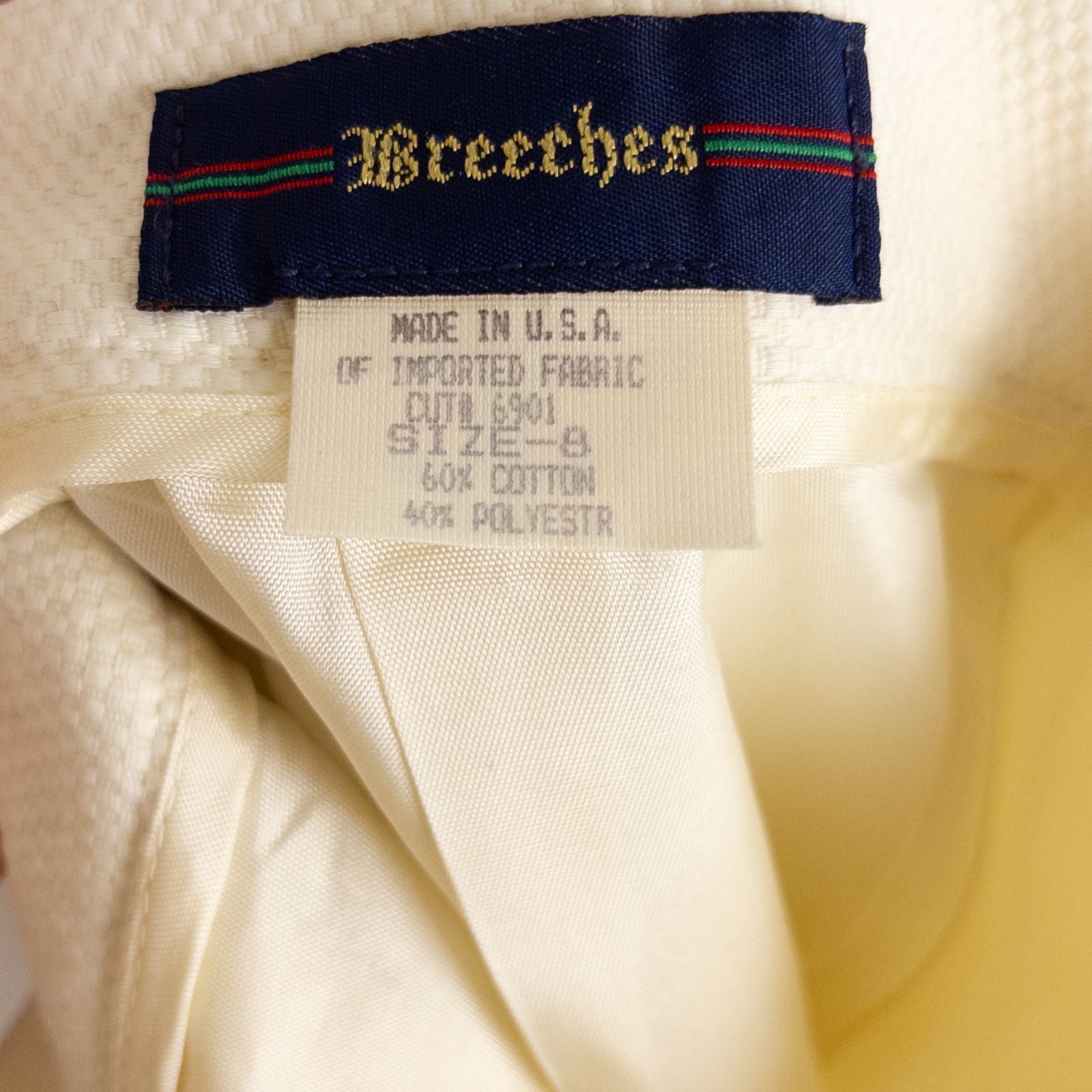 Vintage ivory pique pencil skirt with side zipper and button tab detail hanging on a hanger image 10