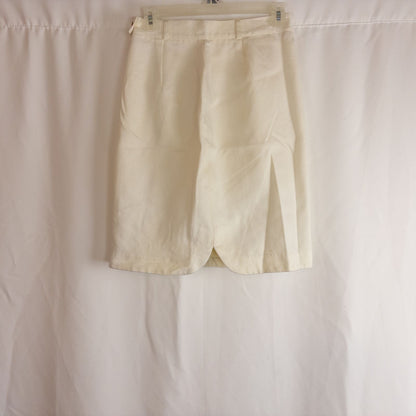 Vintage ivory pique pencil skirt with side zipper and button tab detail hanging on a hanger image 6