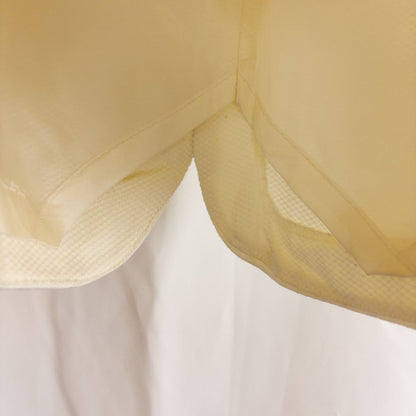Vintage ivory pique pencil skirt with side zipper and button tab detail hanging on a hanger image 9