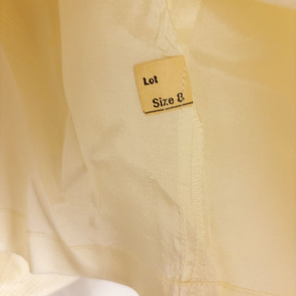 Vintage ivory pique pencil skirt with side zipper and button tab detail hanging on a hanger image 12