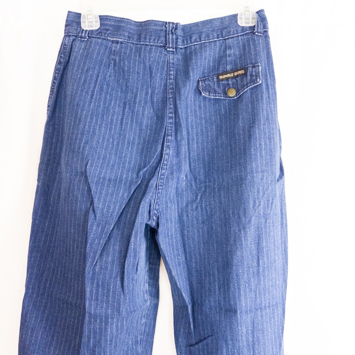 Wilkins rumble seat vintage blue striped jeans womens size 28 hanging on wood hanger in front of white background image 8