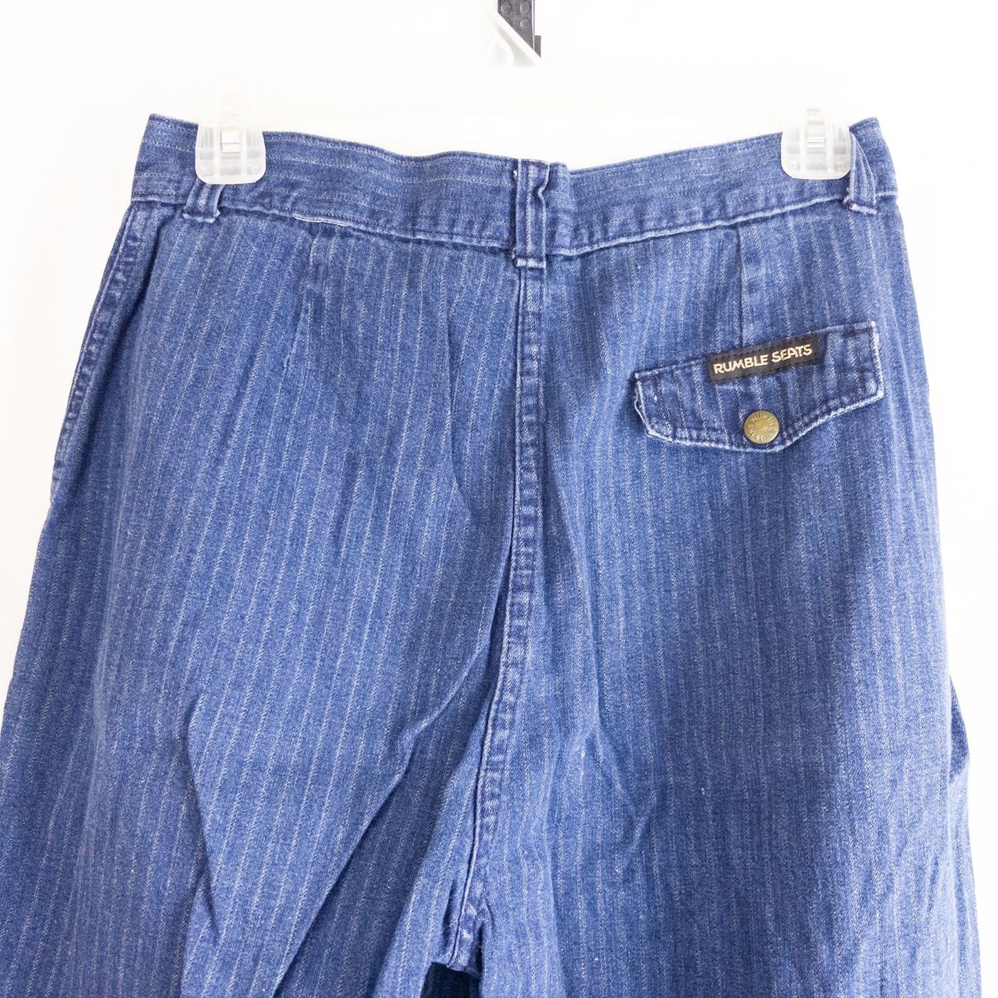 Wilkins rumble seat vintage blue striped jeans womens size 28 hanging on wood hanger in front of white background image 9