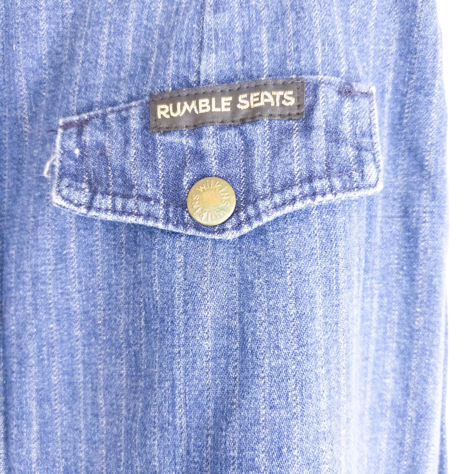 Wilkins rumble seat vintage blue striped jeans womens size 28 hanging on wood hanger in front of white background image 10