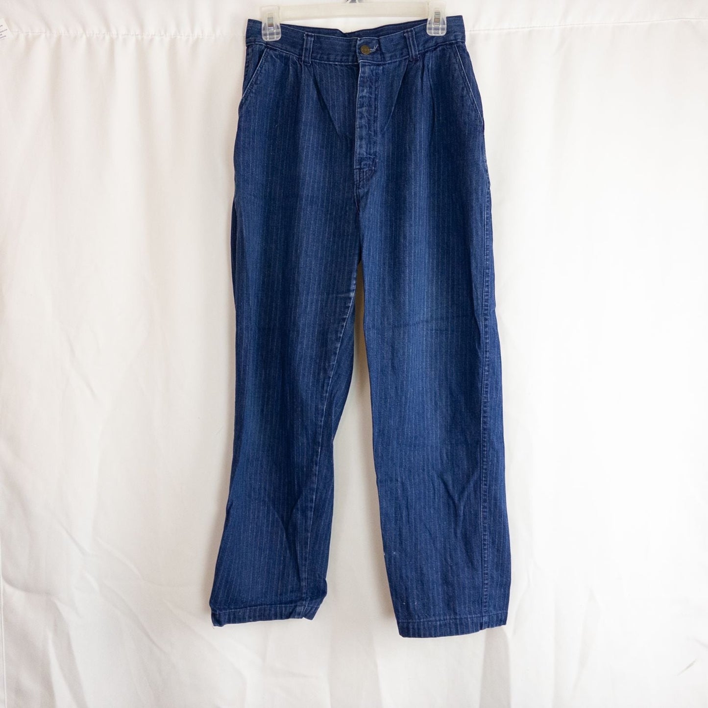 Wilkins rumble seat vintage blue striped jeans womens size 28 hanging on wood hanger in front of white background