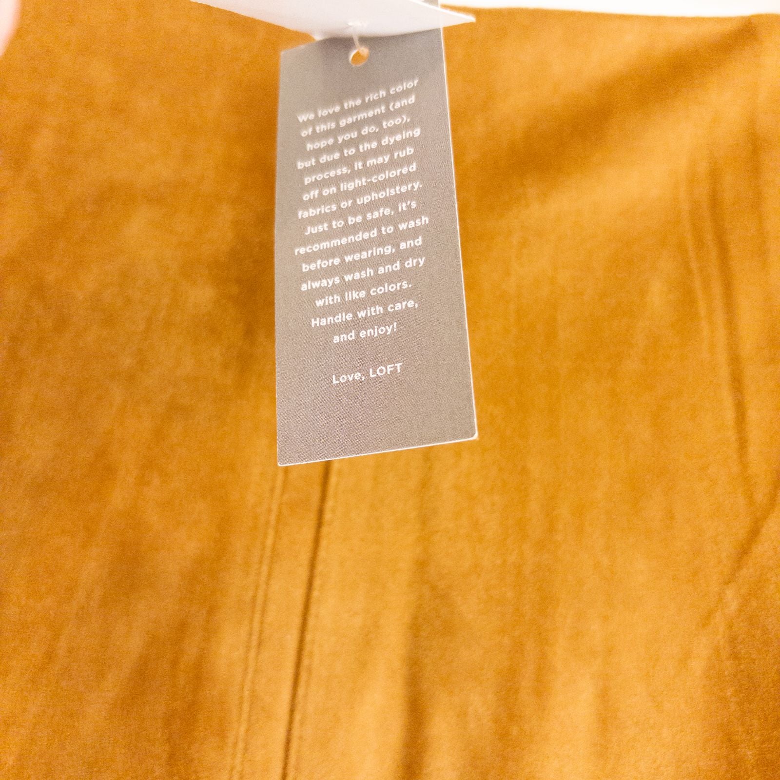 Loft brown suede flair mini skirt womens size 0 hanging on clear plastic hanger against white background image 8