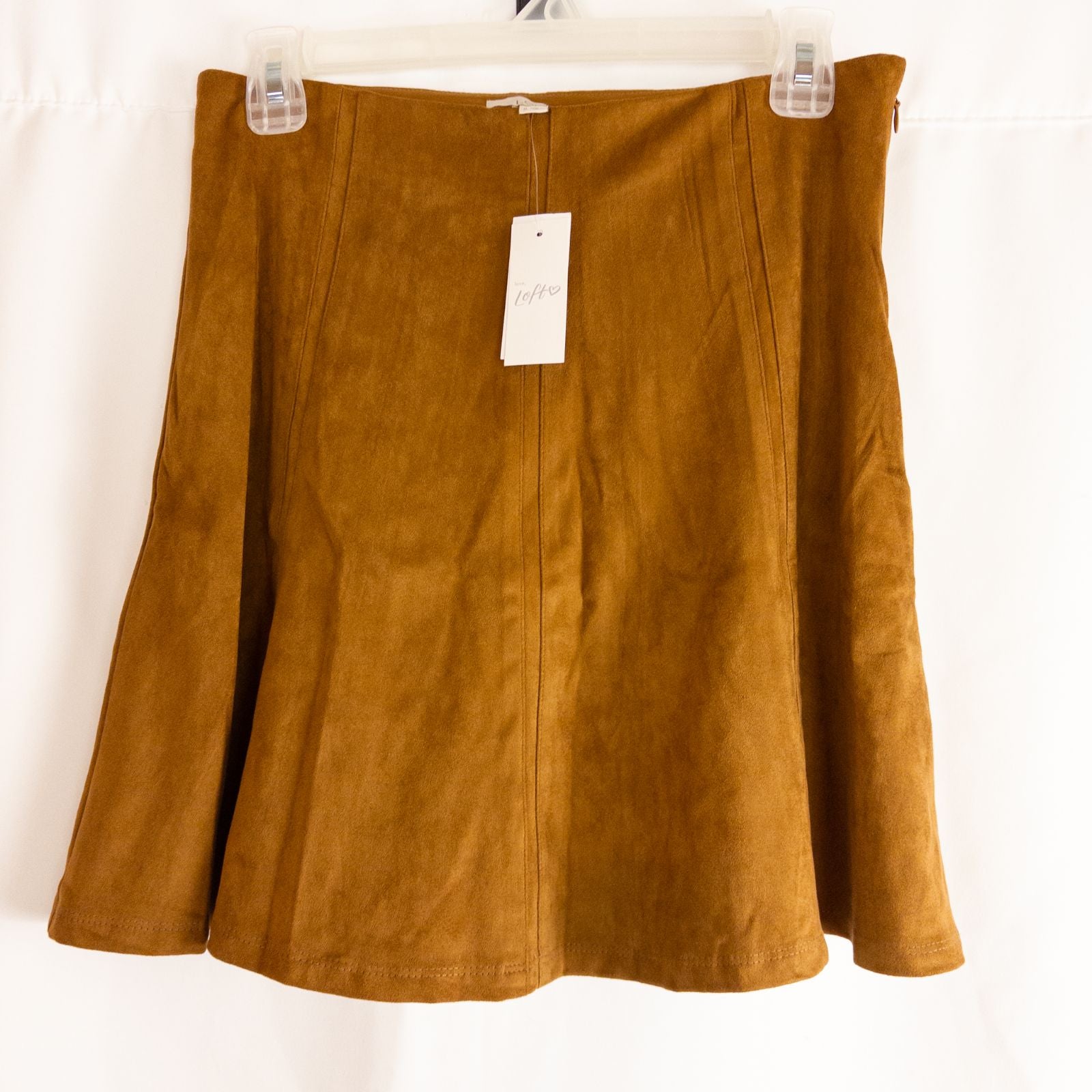 Loft brown suede flair mini skirt womens size 0 hanging on clear plastic hanger against white background image 6