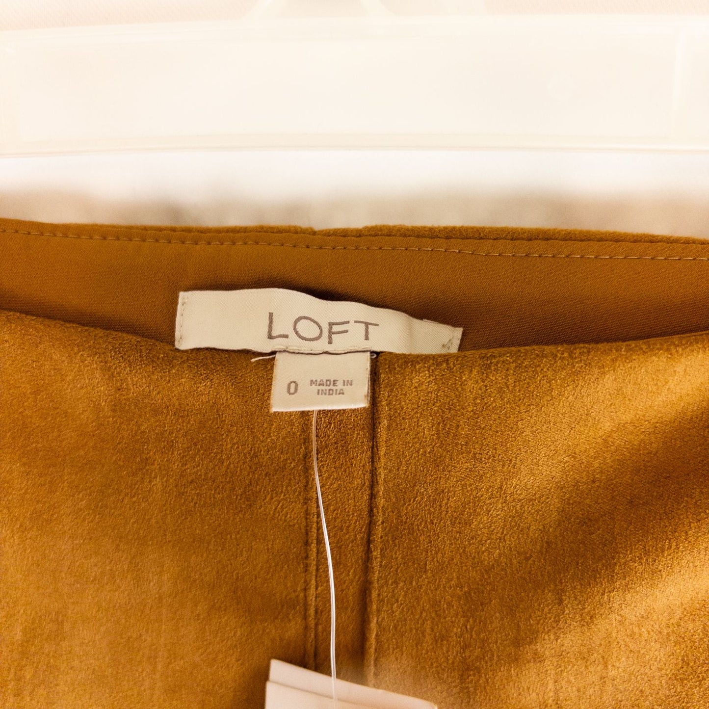 Loft brown suede flair mini skirt womens size 0 hanging on clear plastic hanger against white background image 10