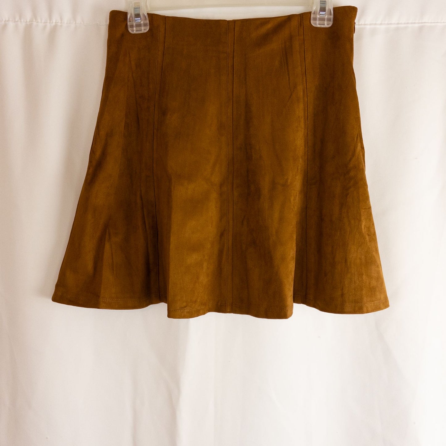 Loft brown suede flair mini skirt womens size 0 hanging on clear plastic hanger against white background