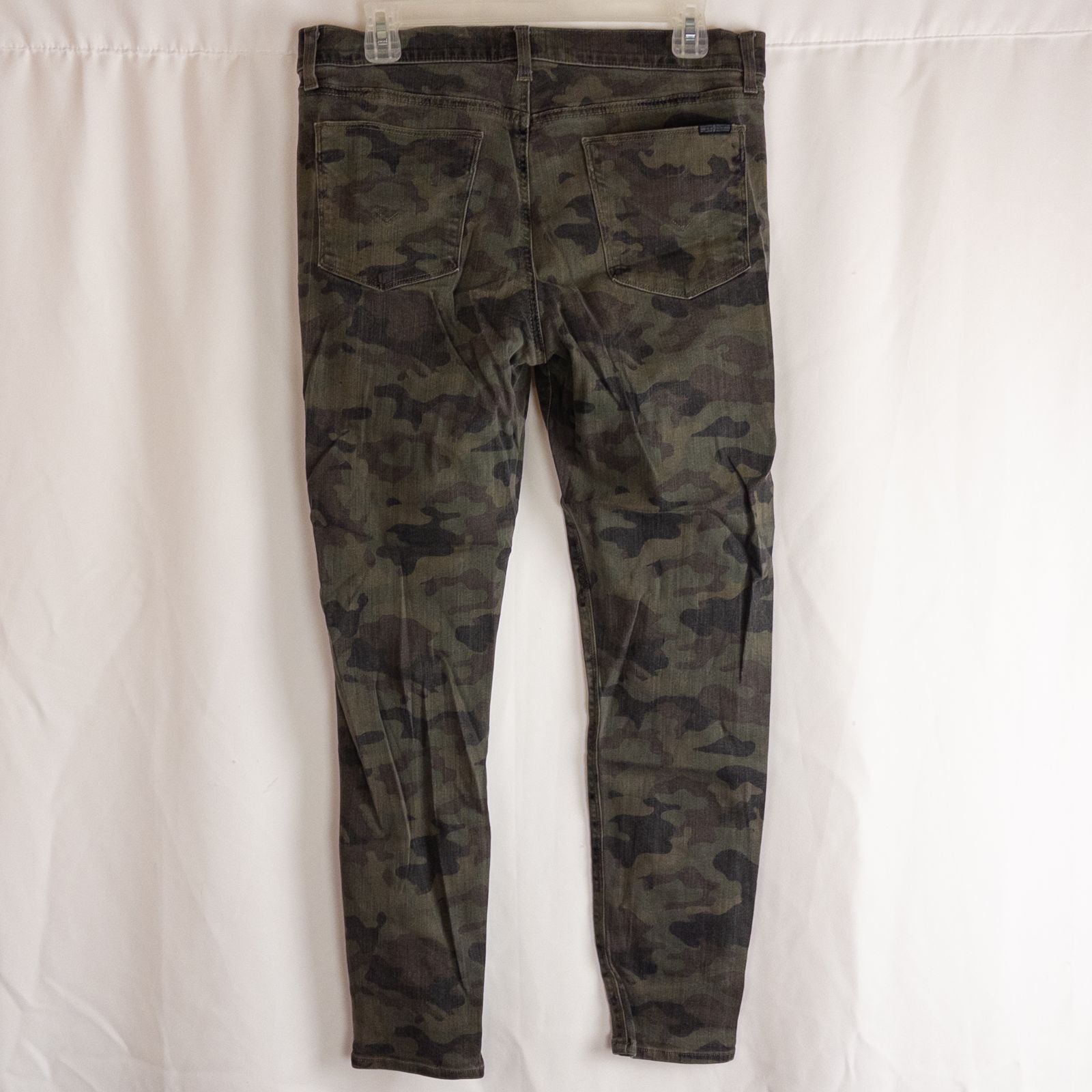 Hudson green camo skinny jeans womens size 31 with minimal wear and faux front pockets displayed hanging. image 5