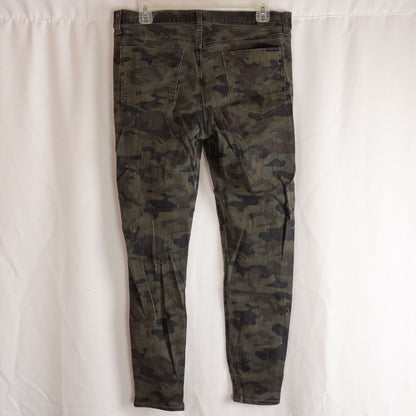 Hudson green camo skinny jeans womens size 31 with minimal wear and faux front pockets displayed hanging. image 5