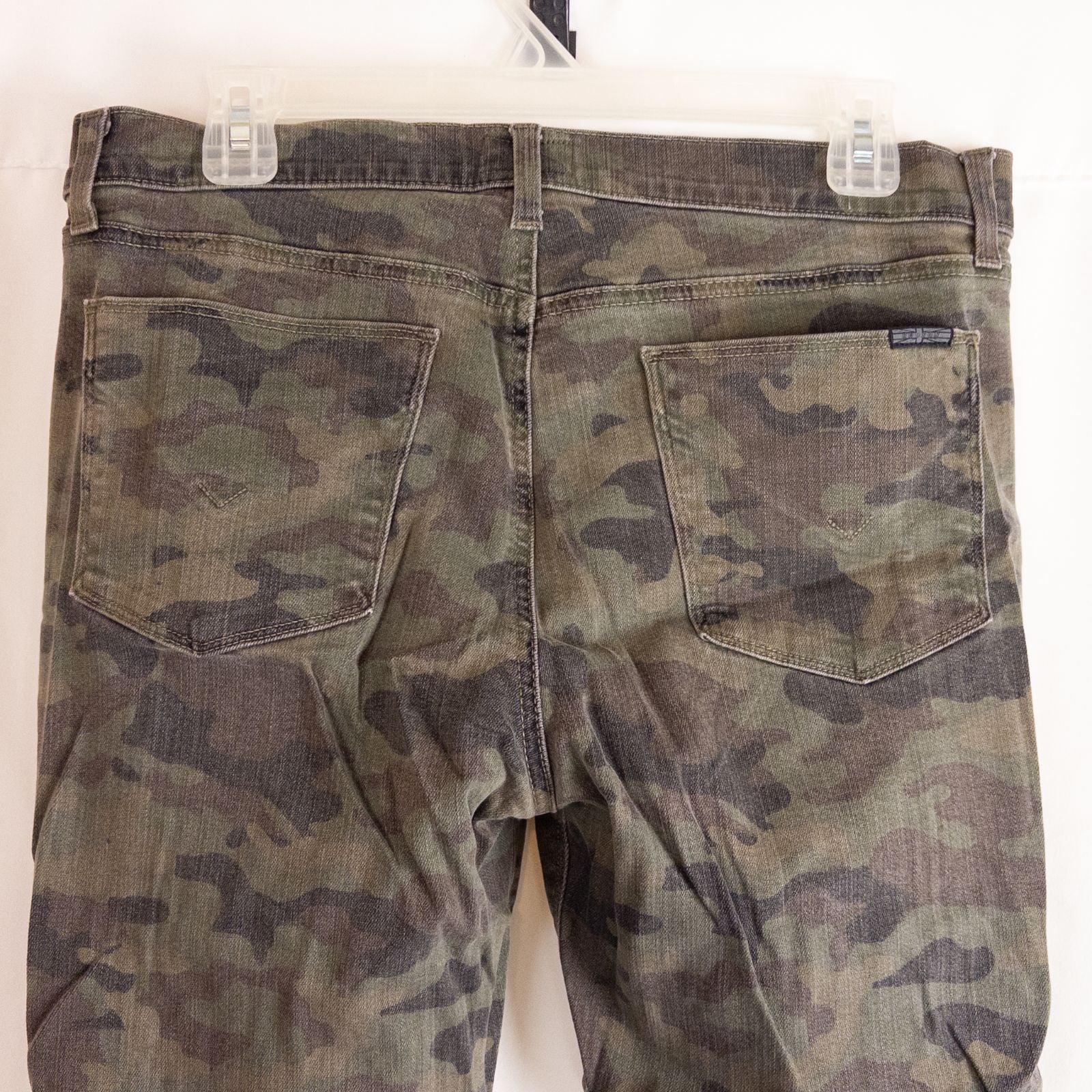 Hudson green camo skinny jeans womens size 31 with minimal wear and faux front pockets displayed hanging. image 6