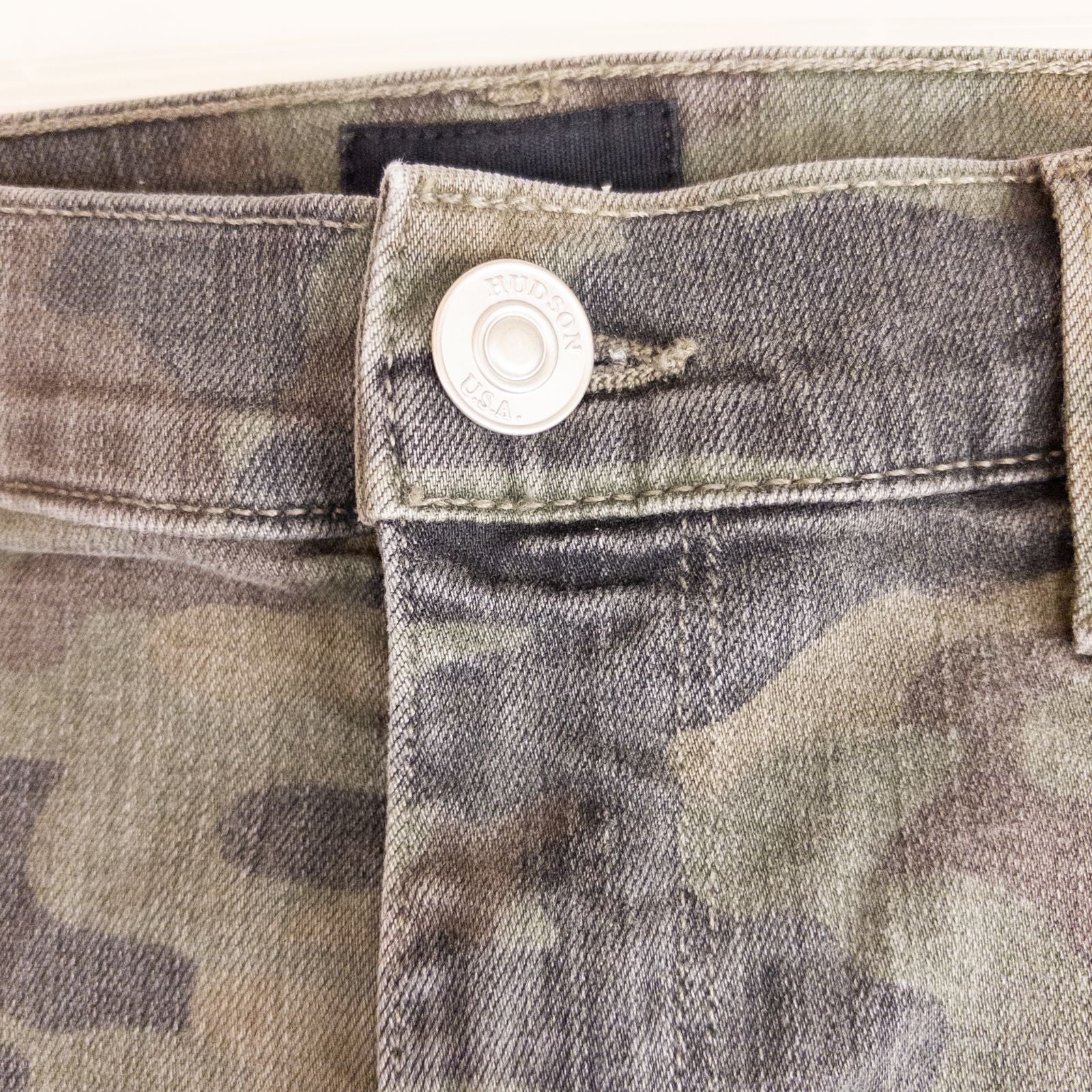 Hudson green camo skinny jeans womens size 31 with minimal wear and faux front pockets displayed hanging. image 3