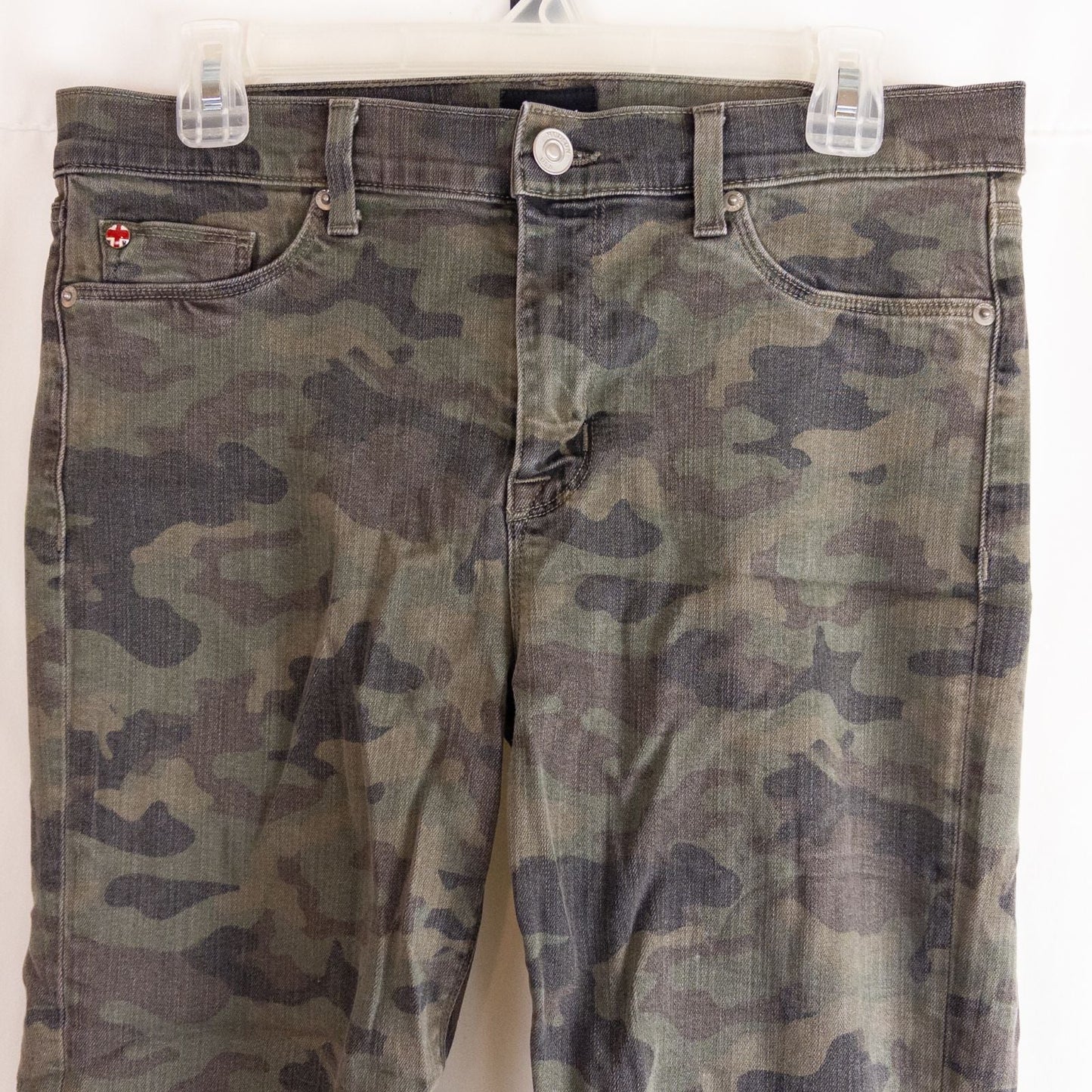 Hudson green camo skinny jeans womens size 31 with minimal wear and faux front pockets displayed hanging. image 2