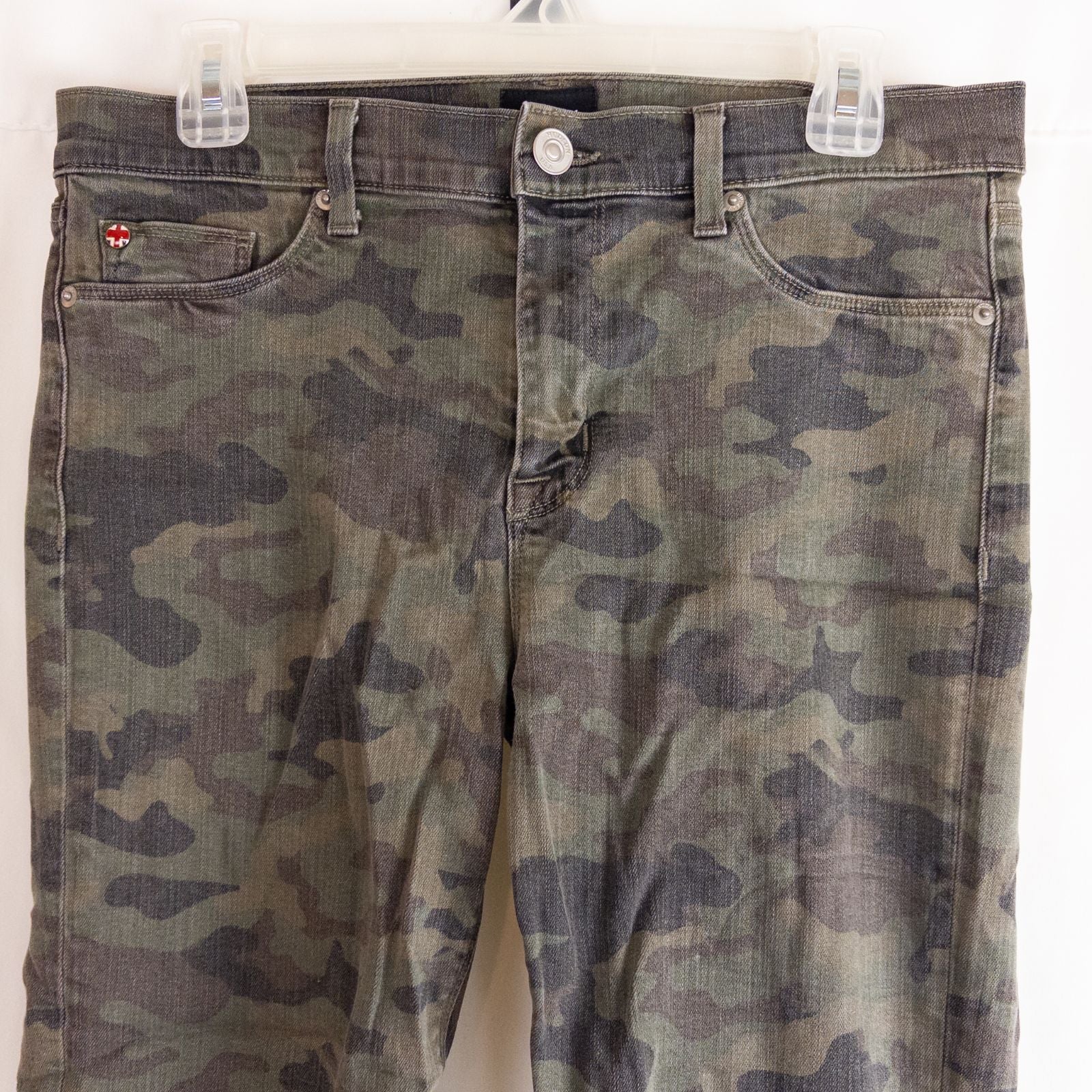 Hudson green camo skinny jeans womens size 31 with minimal wear and faux front pockets displayed hanging. image 2