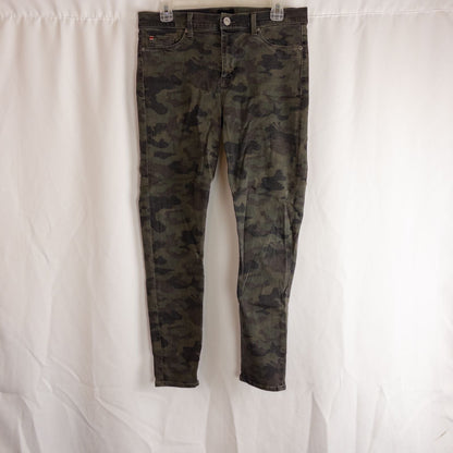 Hudson green camo skinny jeans womens size 31 with minimal wear and faux front pockets displayed hanging.