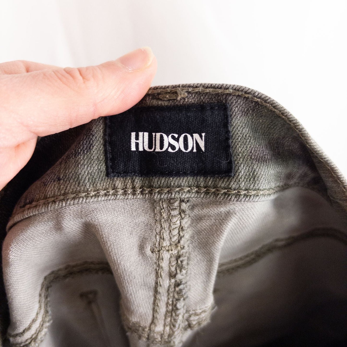 Hudson green camo skinny jeans womens size 31 with minimal wear and faux front pockets displayed hanging. image 8