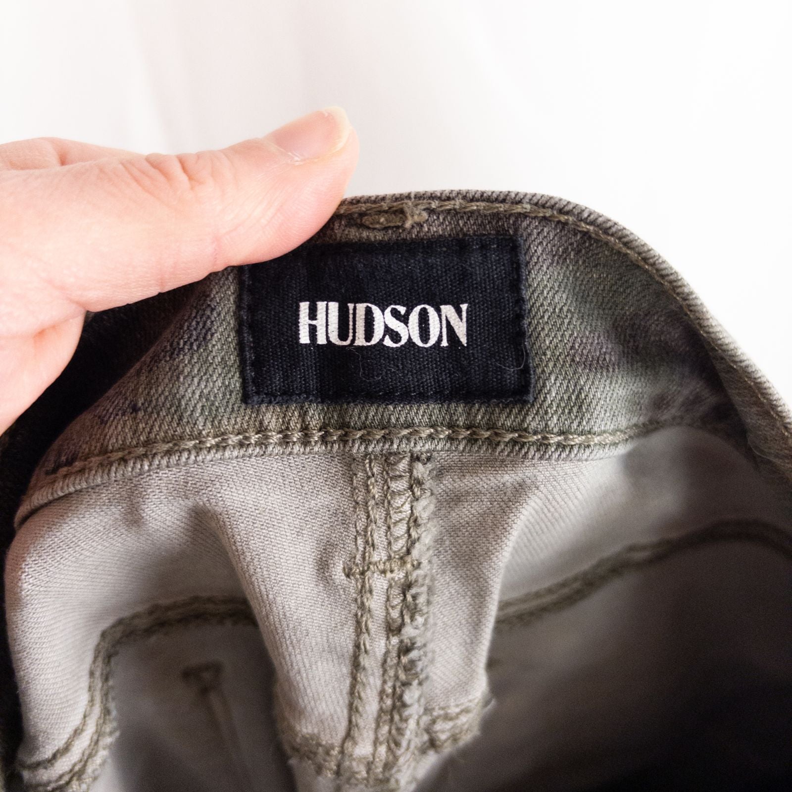 Hudson green camo skinny jeans womens size 31 with minimal wear and faux front pockets displayed hanging. image 8