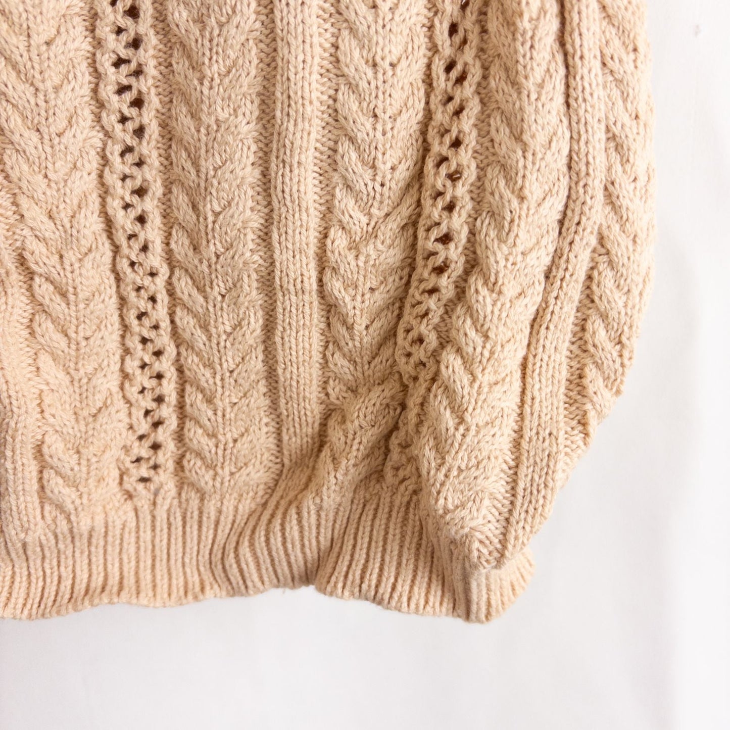 Talbots tan vintage cable knit cardigan sweater with button front and shoulder pads hanging on clear hanger image 4
