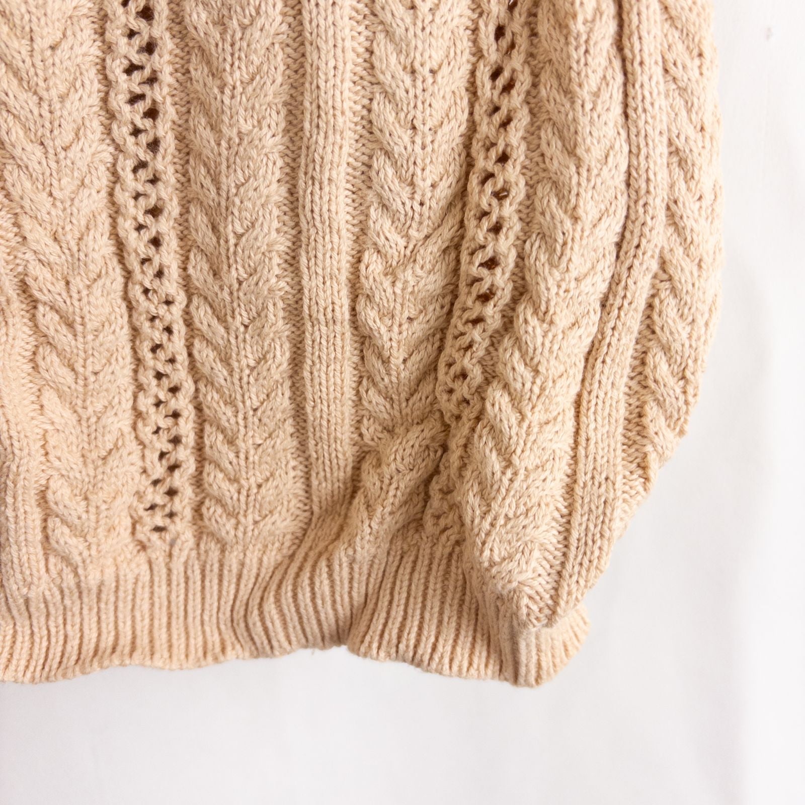 Talbots tan vintage cable knit cardigan sweater with button front and shoulder pads hanging on clear hanger image 4