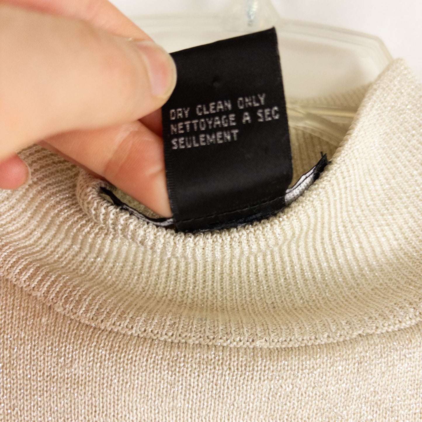 Silver knit long sleeve August Silk sweater with mock neckline laid flat showing subtle shimmer and texture image 11