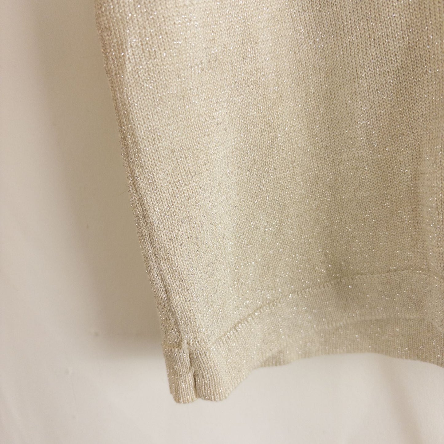 Silver knit long sleeve August Silk sweater with mock neckline laid flat showing subtle shimmer and texture image 4