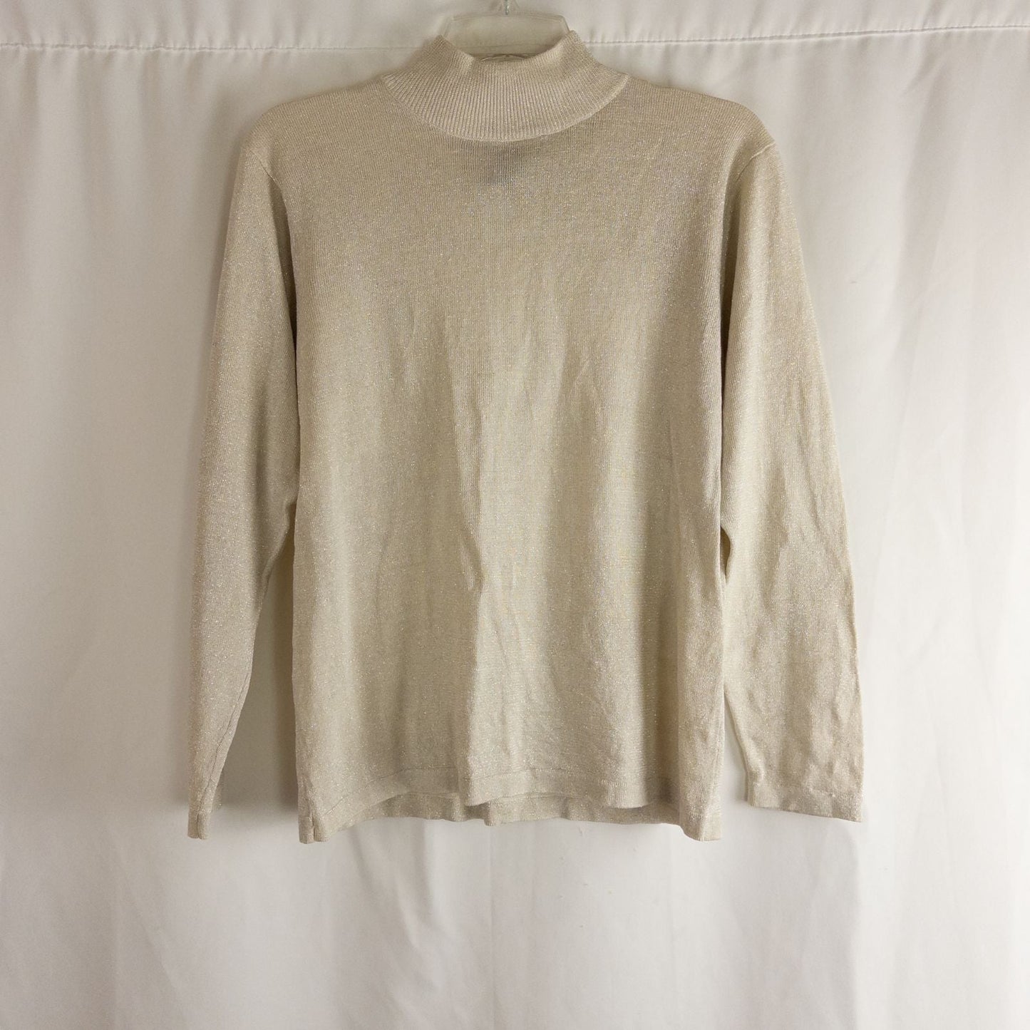 Silver knit long sleeve August Silk sweater with mock neckline laid flat showing subtle shimmer and texture