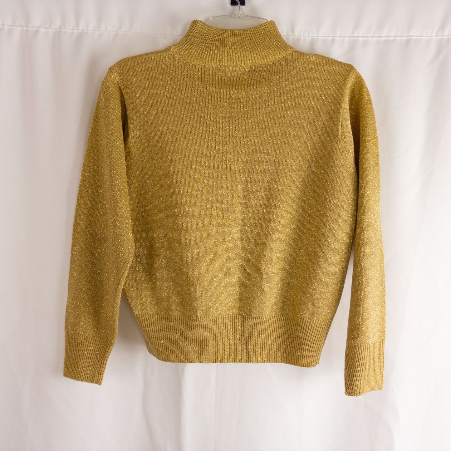 Dress Barn petite gold knit sweater with mock neck and long sleeves hung on a clear hanger image 5