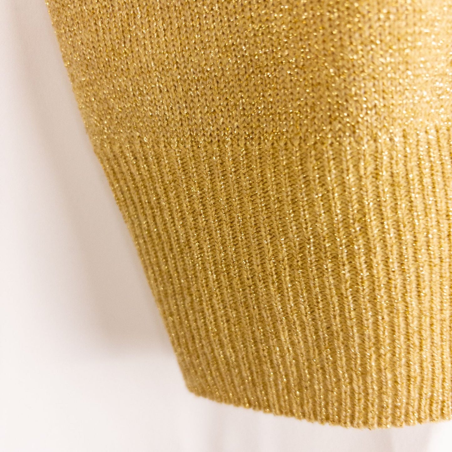 Dress Barn petite gold knit sweater with mock neck and long sleeves hung on a clear hanger image 4