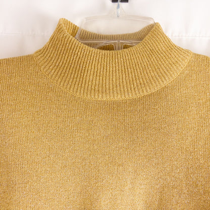 Dress Barn petite gold knit sweater with mock neck and long sleeves hung on a clear hanger image 2