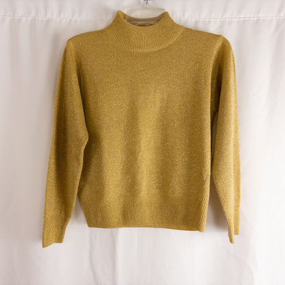 Dress Barn petite gold knit sweater with mock neck and long sleeves hung on a clear hanger
