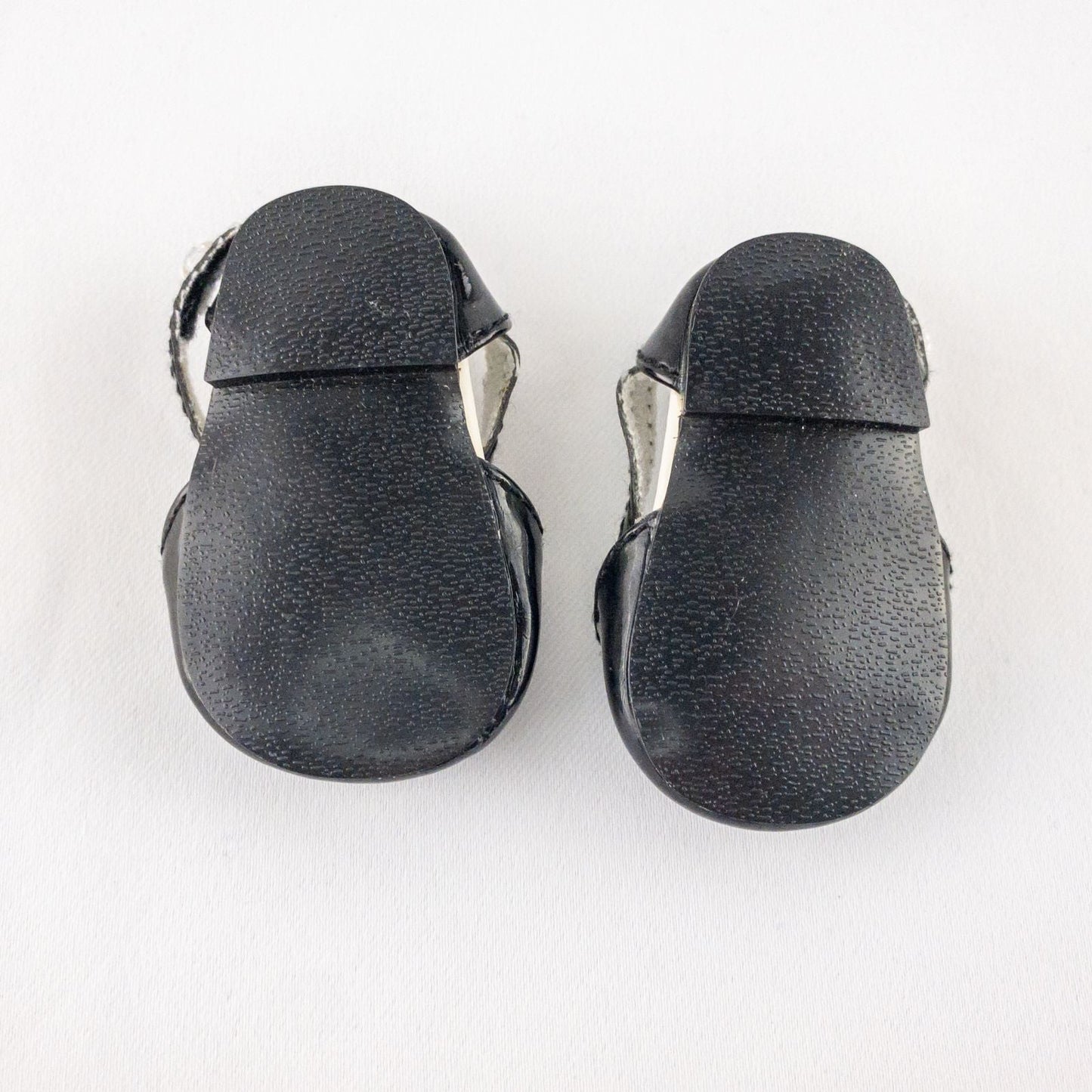 Pair of American Girl Joyful Jewels black doll shoes with rhinestone detail, viewed from front, side, and bottom angles. image 3