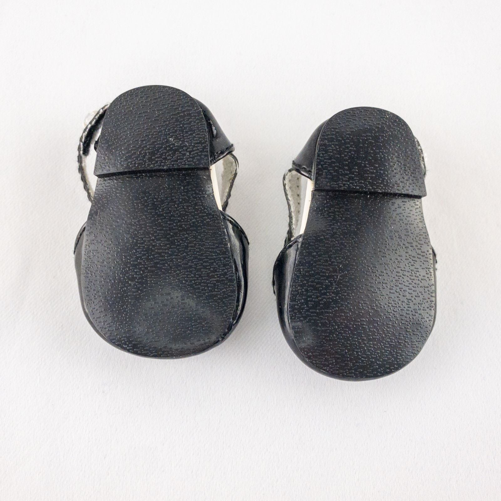 Pair of American Girl Joyful Jewels black doll shoes with rhinestone detail, viewed from front, side, and bottom angles. image 3