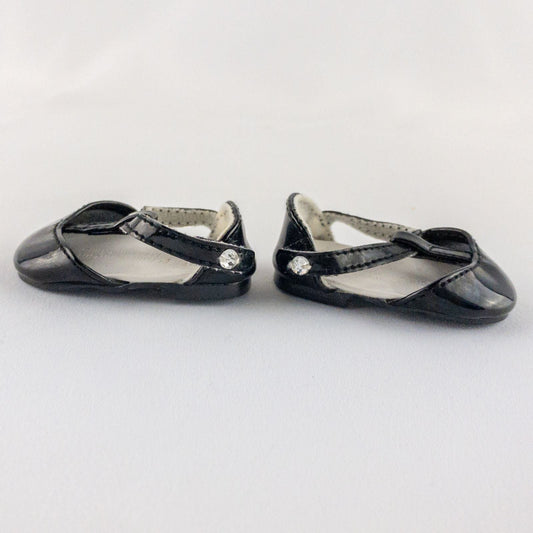 Pair of American Girl Joyful Jewels black doll shoes with rhinestone detail, viewed from front, side, and bottom angles. image 2
