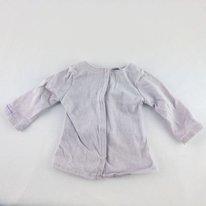 American Girl purple charmed top, matching pants, purple shoes, underwear, and charm necklace doll outfit laid flat image 3