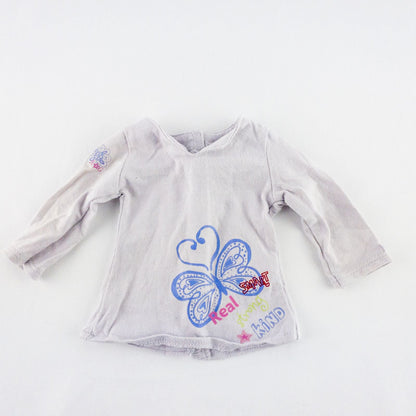American Girl purple charmed top, matching pants, purple shoes, underwear, and charm necklace doll outfit laid flat image 2