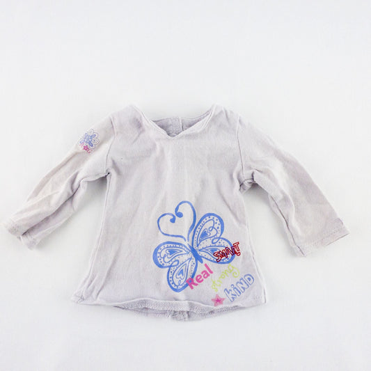 American Girl purple charmed top, matching pants, purple shoes, underwear, and charm necklace doll outfit laid flat image 2