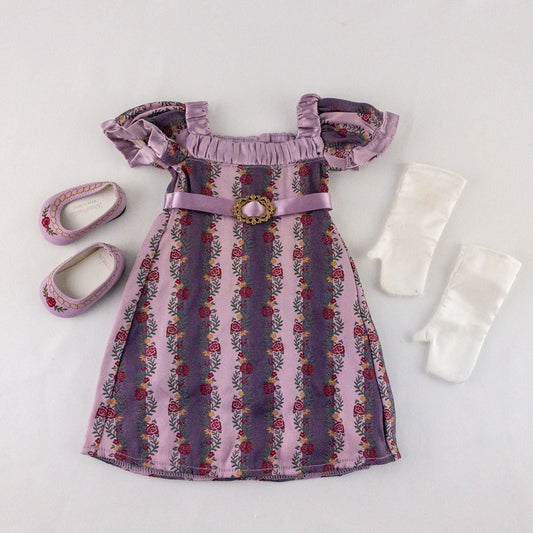 American Girl purple floral gown dress set with satin belt, white gloves, and matching shoes laid flat