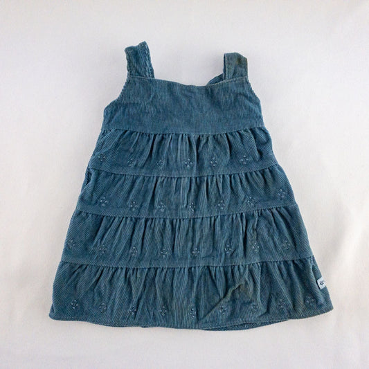 American Girl doll jumper dress outfit with blue corduroy jumper dress, faded light blue long sleeve top, and blue doll boots laid flat on white background image 2