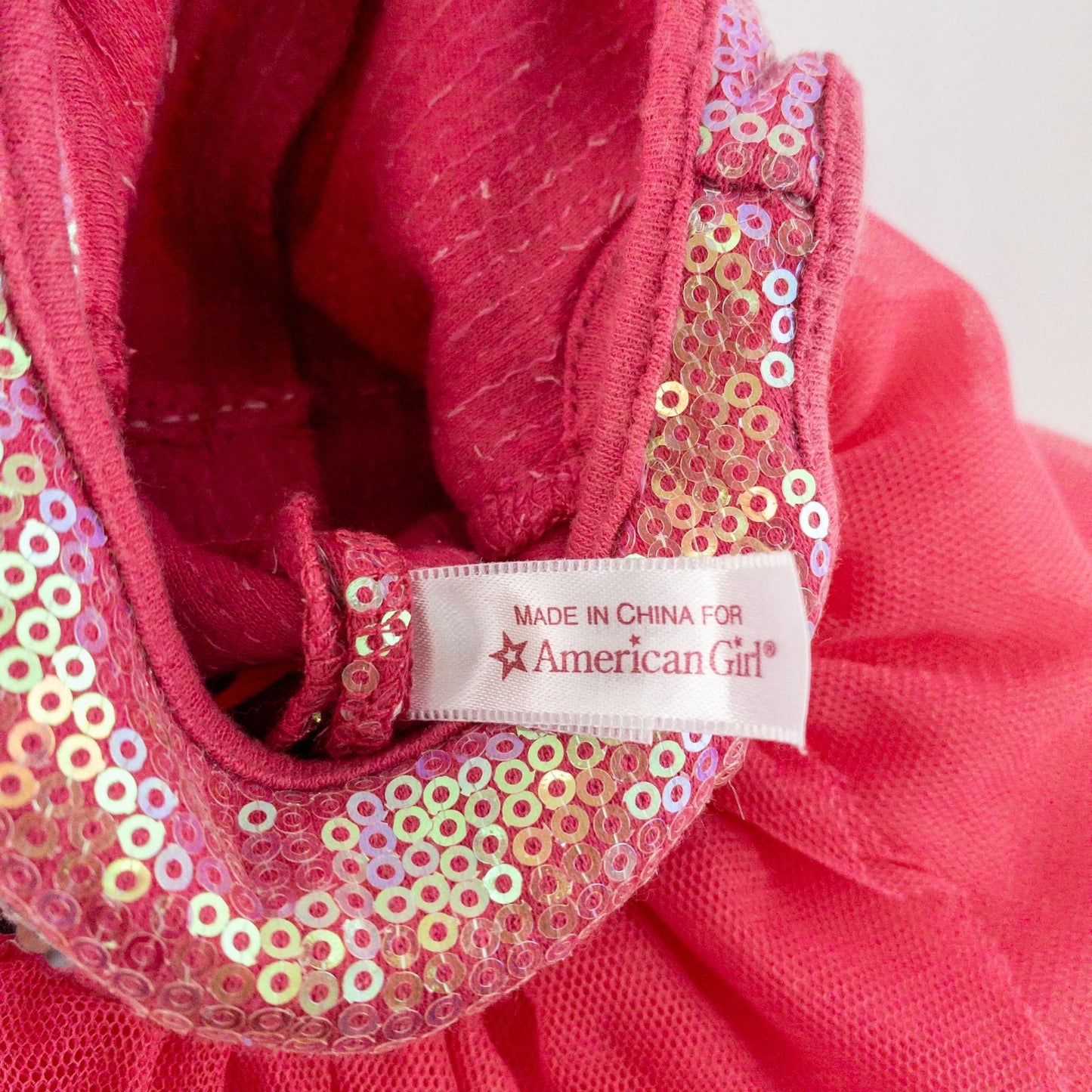 American Girl pink ballet dress with sequin bodice and tulle skirt with matching slippers laid flat on white background showing front and back details image 10